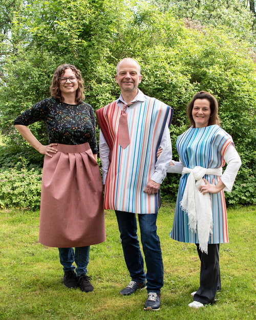 Three team members from Sattler wearing garments made from CANOPY fabric during a photo shoot celebrating 10 years of the MADE IN GREEN by OEKO-TEX® label.